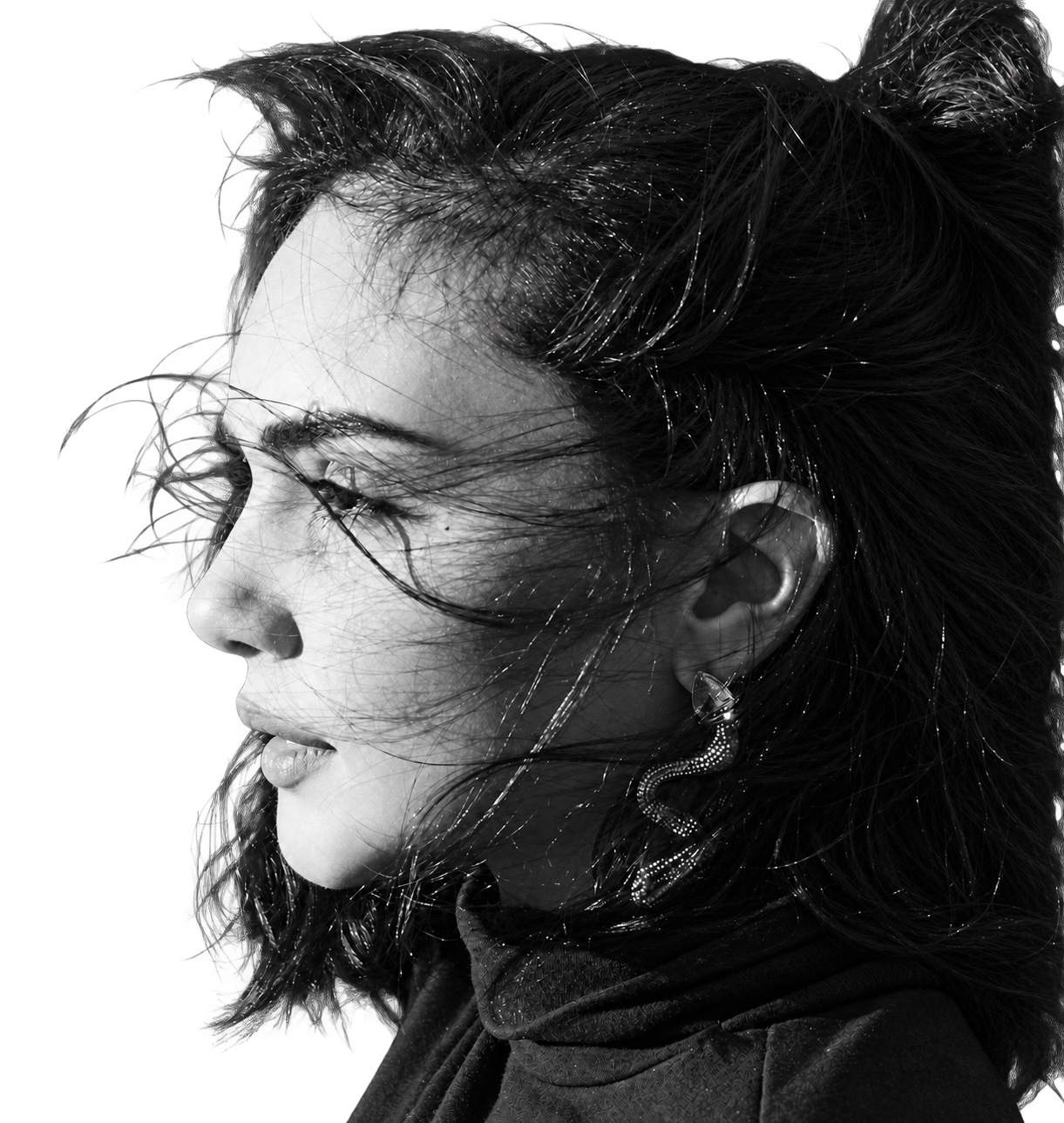 Black-and-white portrait of tattoo artist Tahia Fakher