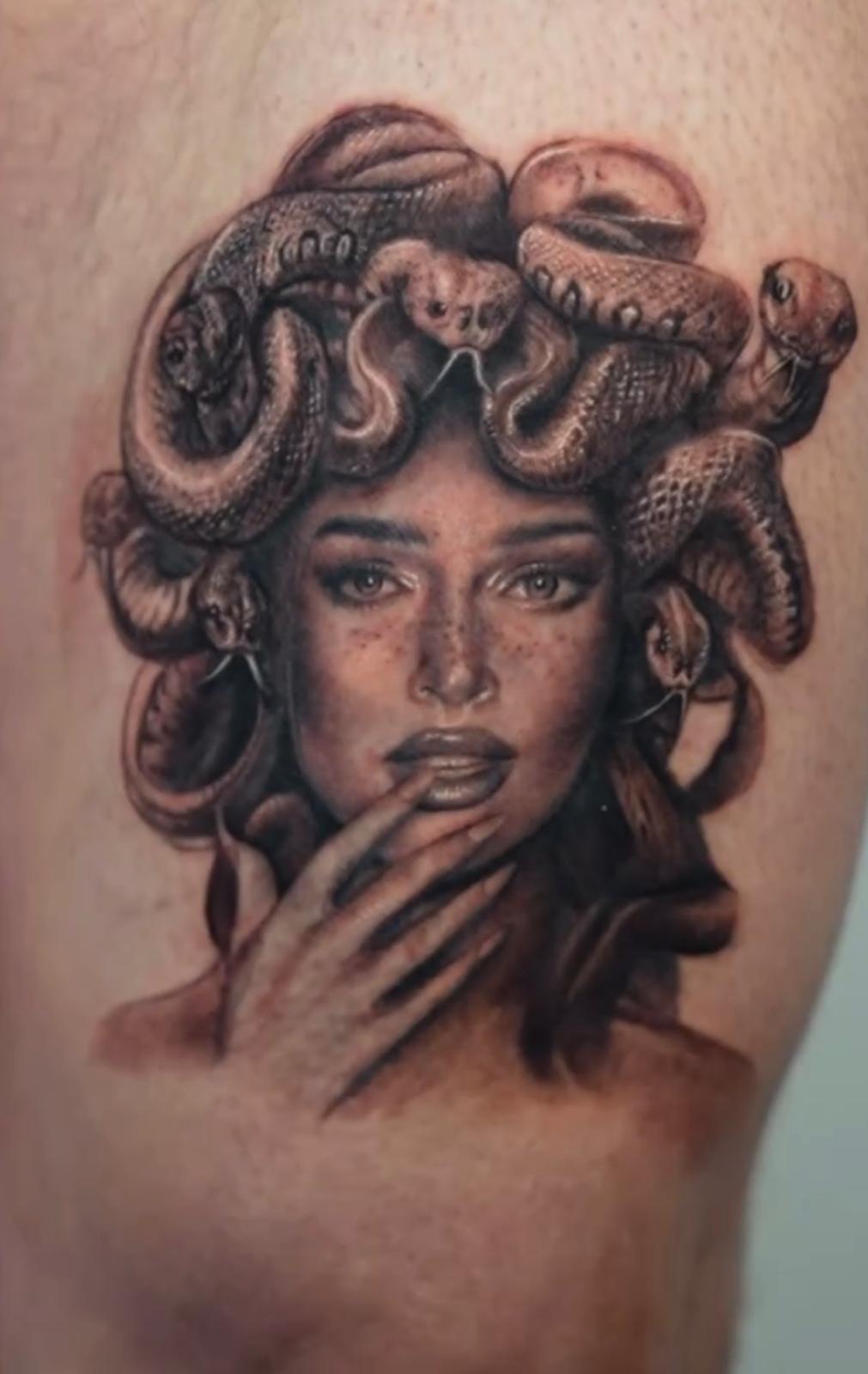 Detailed realism tattoo of a woman with snakes