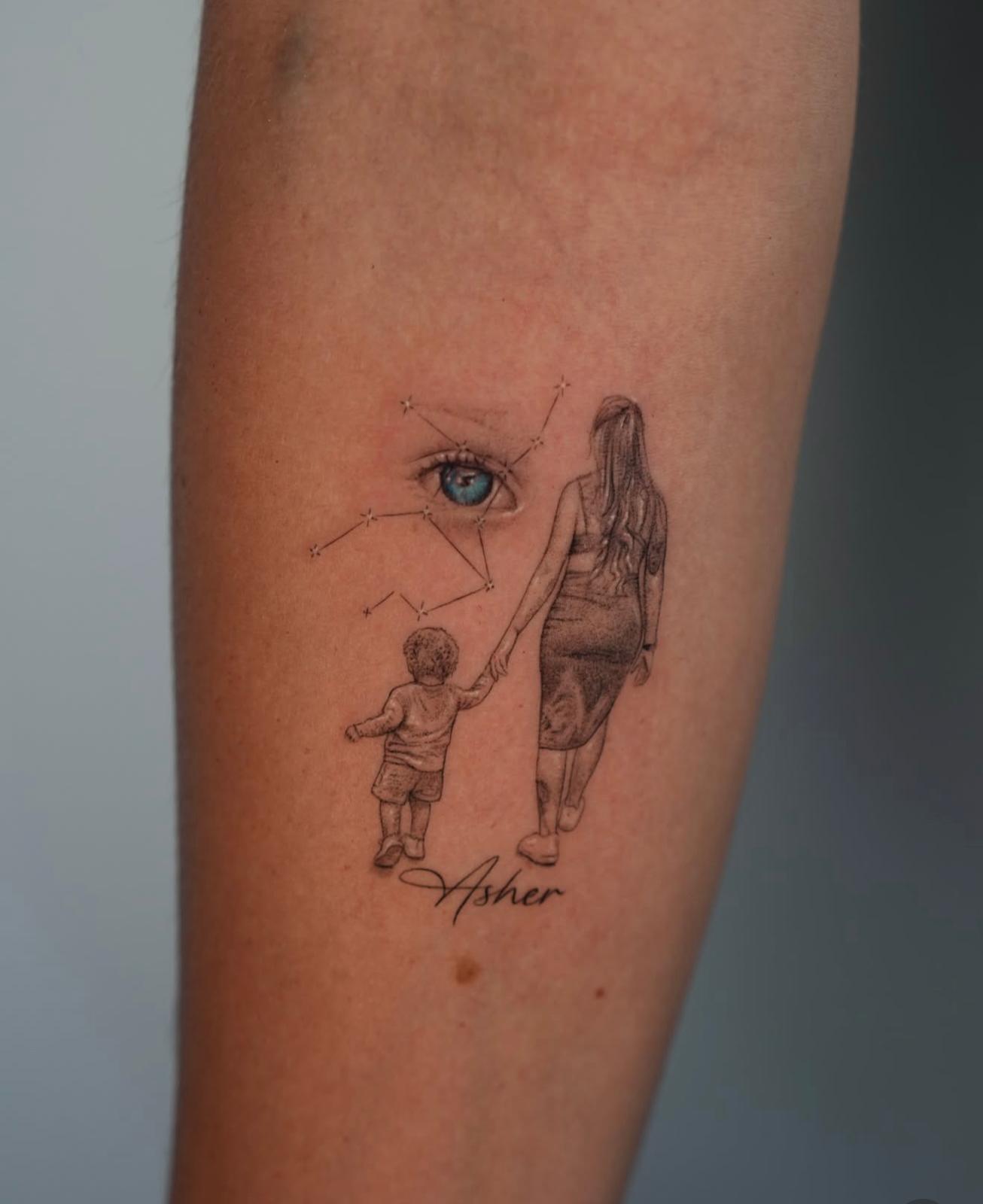 Fine line memorial tattoo of a mother and child